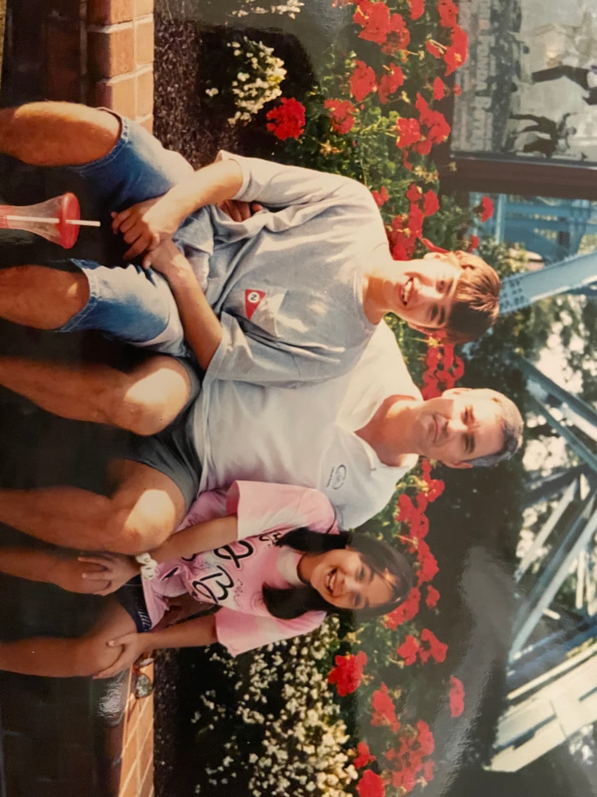 Kerry with Aaron and Maura at a theme park