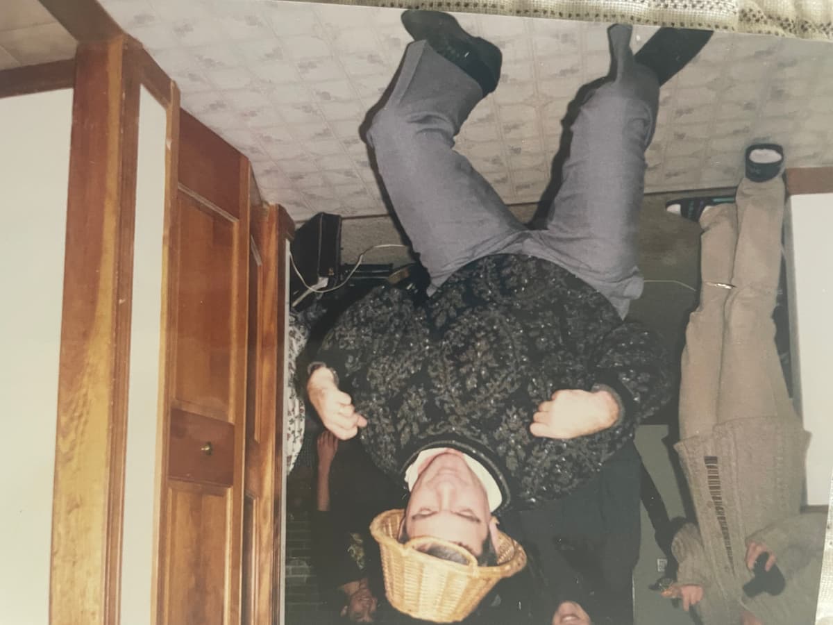 Kerry dancing at a party with basket hat